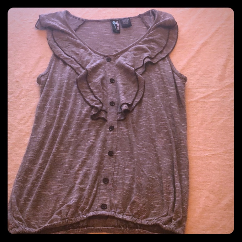 Grey Blouse with buttons sewn on the front.